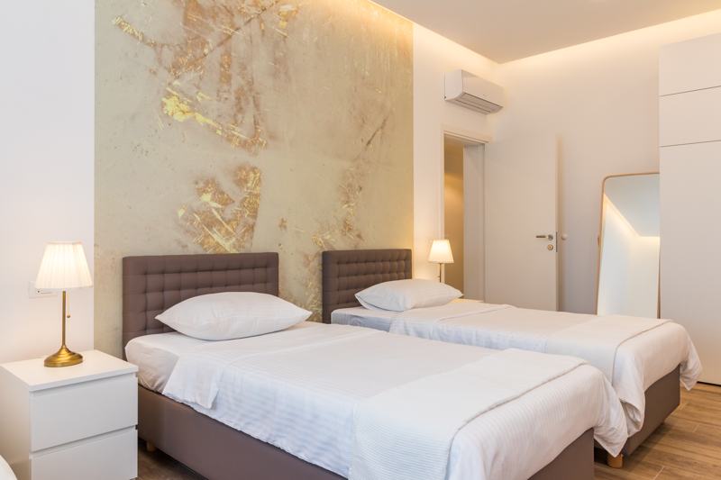 Bedroom with gold feature wall
